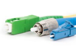 collection of different single mode fiber optic connectors isolated on white background